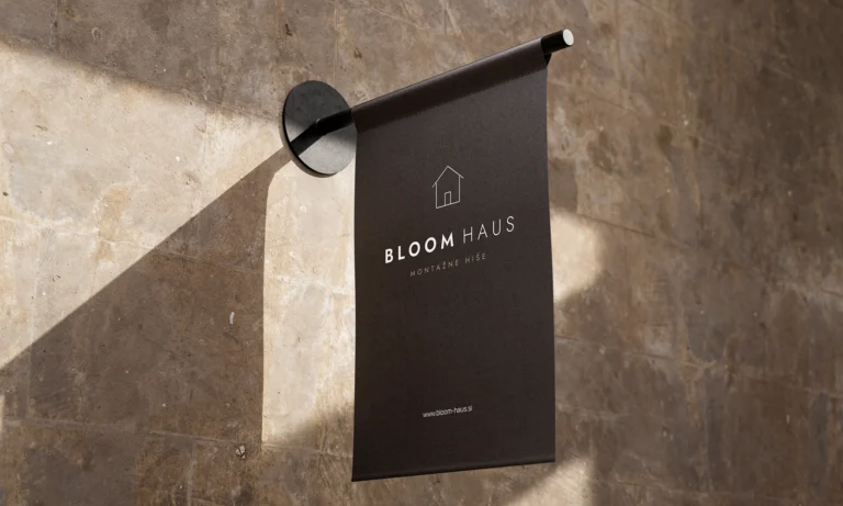 Bloom Haus logo: brand mockup on a hanging sign by the wall